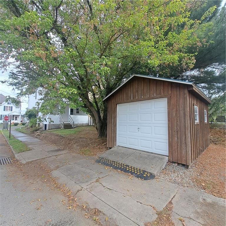 439 Longfellow Street Vandergrift, PA 15690 - Photo 48 of 49 a small barn with a large tree in front of it