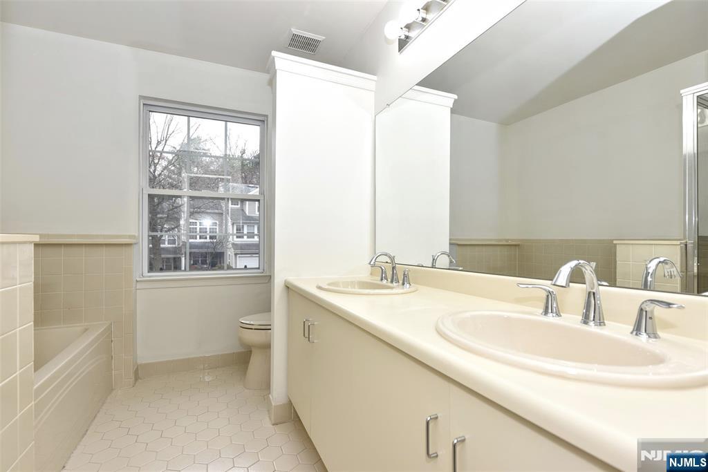 1499 Cornwall Road Mahwah, NJ 07430 - Photo 13 of 26 a bathroom with a sink and a bathtub