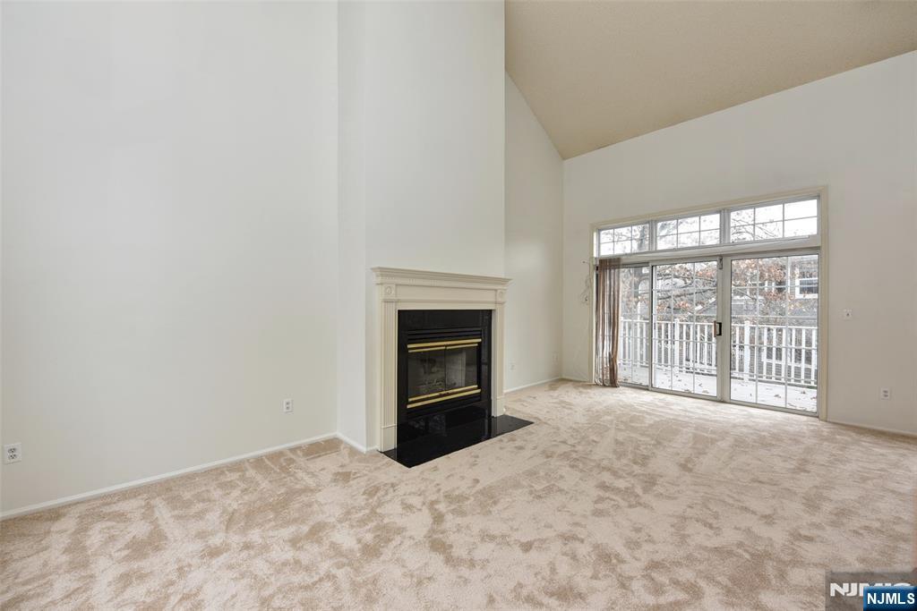 1499 Cornwall Road Mahwah, NJ 07430 - Photo 4 of 26 a view of an empty room with a fireplace and a window