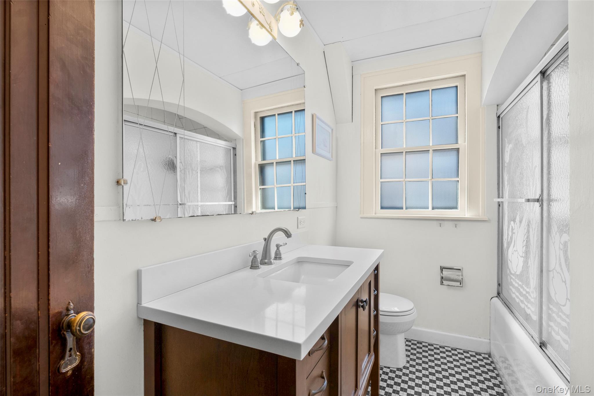 116 Reed Avenue Pelham, NY 10803 - Photo 16 of 22 a bathroom with a sink toilet a shower and a mirror