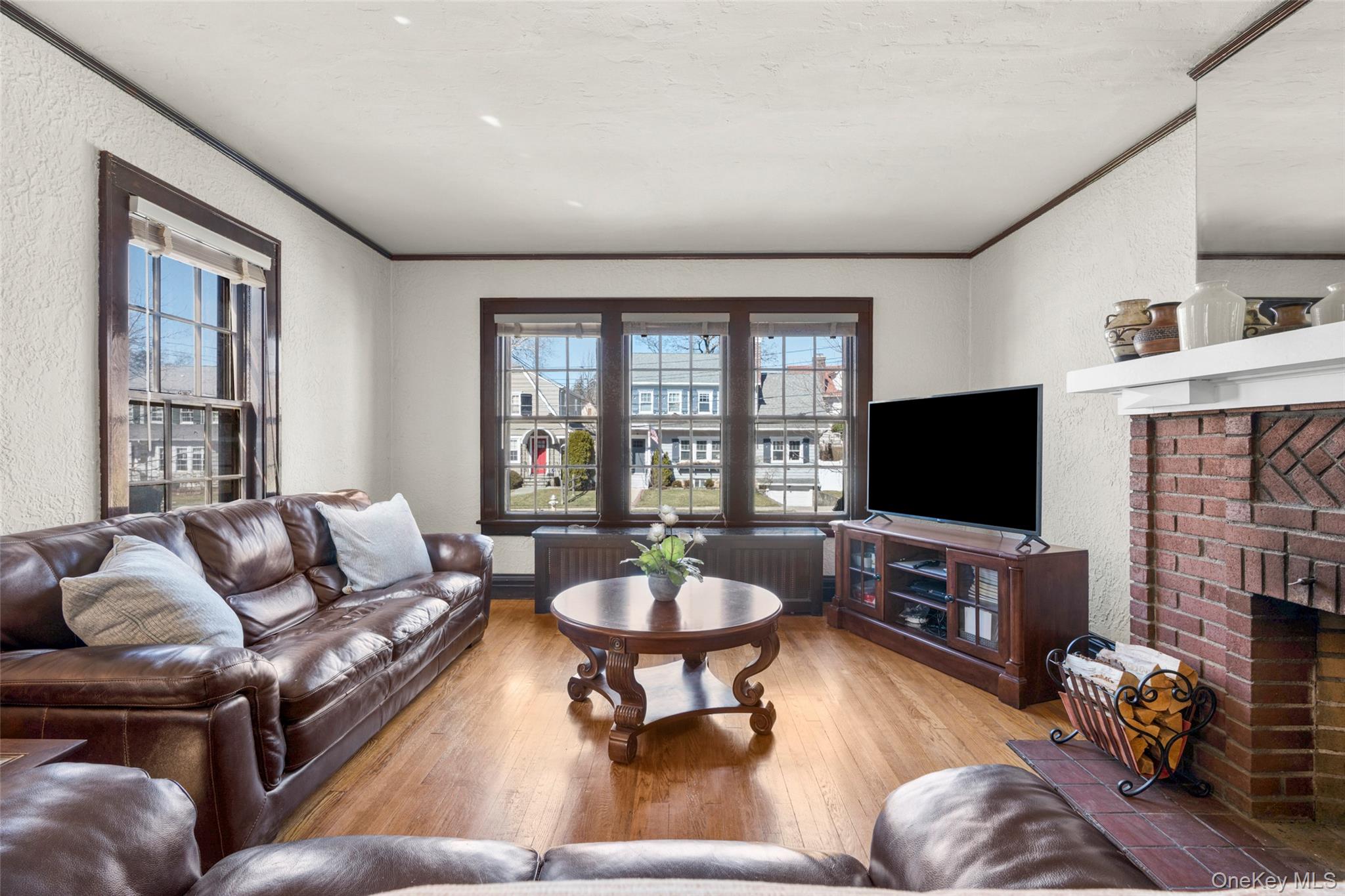 116 Reed Avenue Pelham, NY 10803 - Photo 4 of 22 a living room with furniture a flat screen tv and a large window