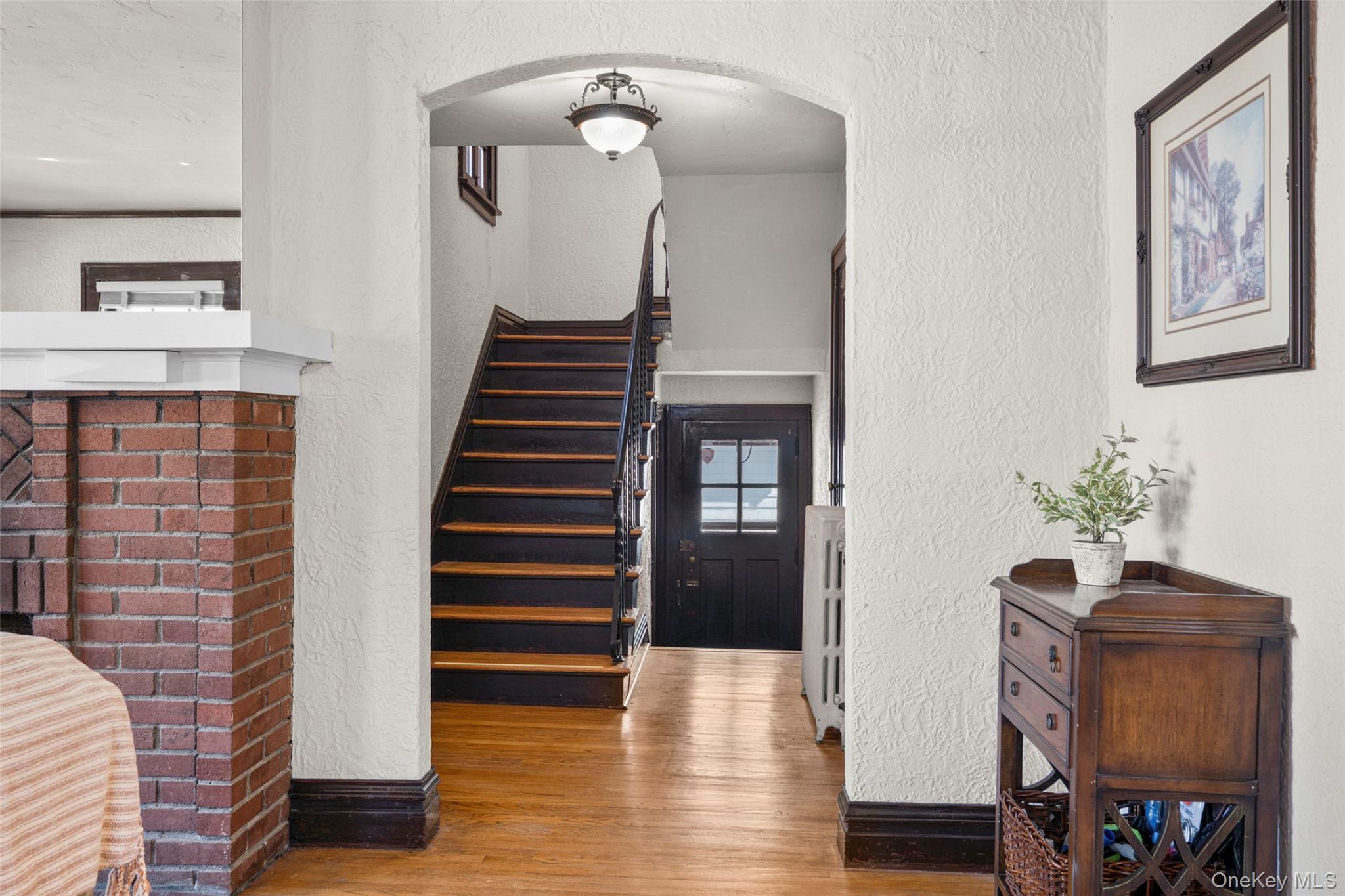 116 Reed Avenue Pelham, NY 10803 - Photo 6 of 22 a view of a hallway with furniture and wooden floor