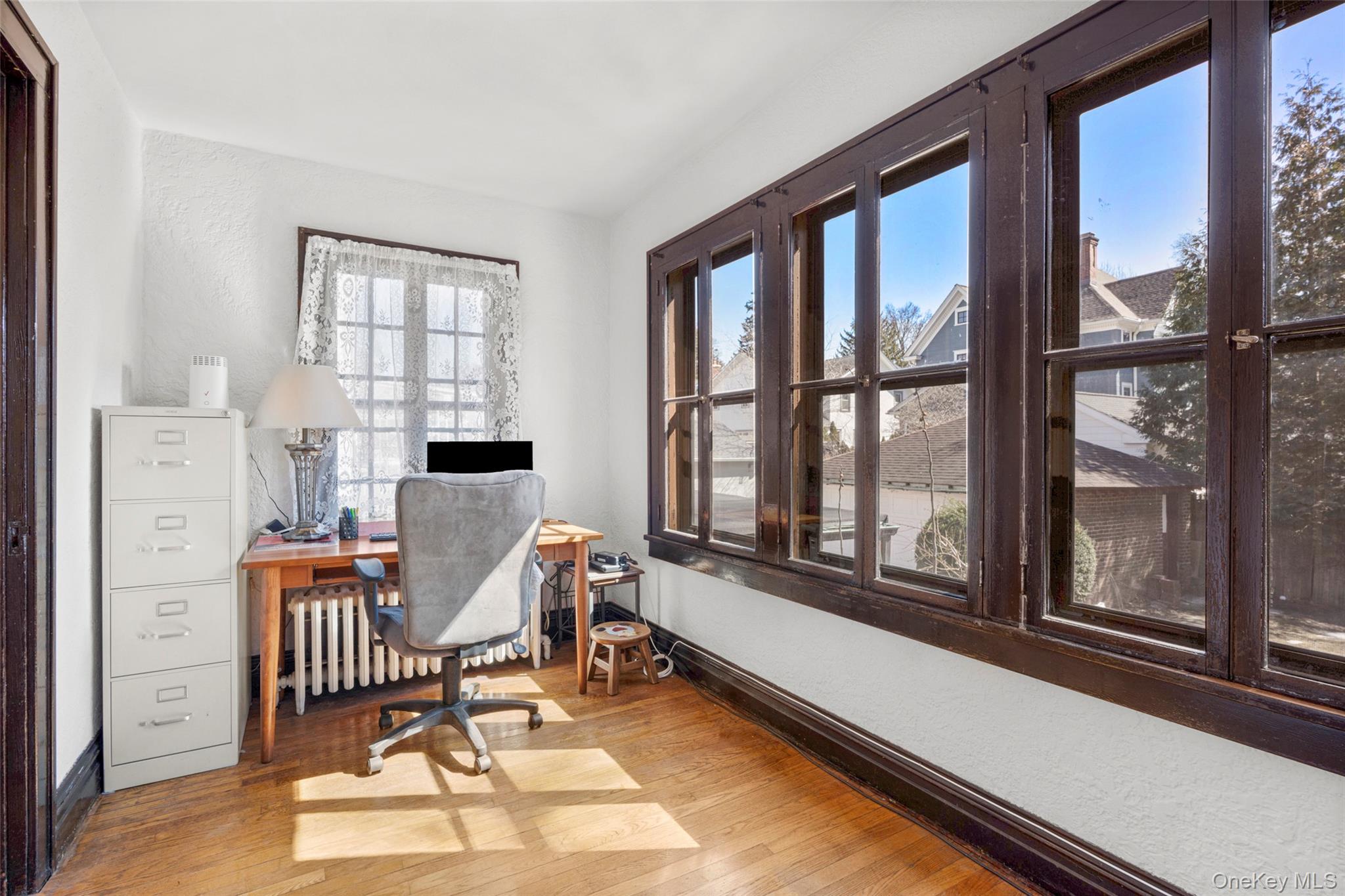 116 Reed Avenue Pelham, NY 10803 - Photo 10 of 22 a work room with furniture and windows