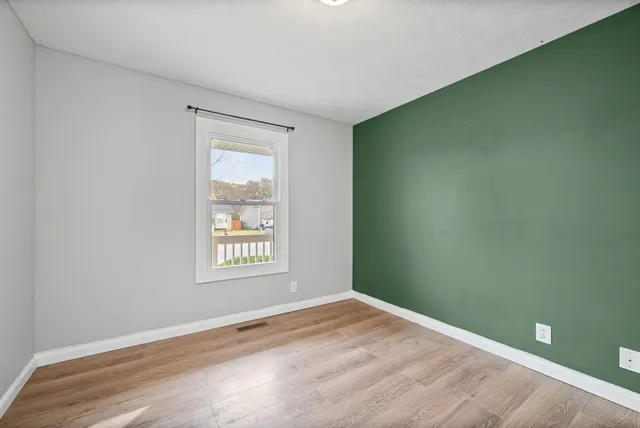 a view of an empty room and window