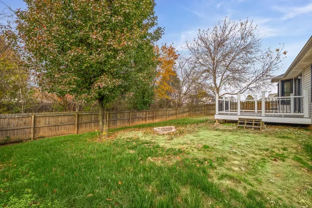 a swimming pool with wooden fence