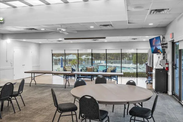 a view of a dining room with furniture window and outside view