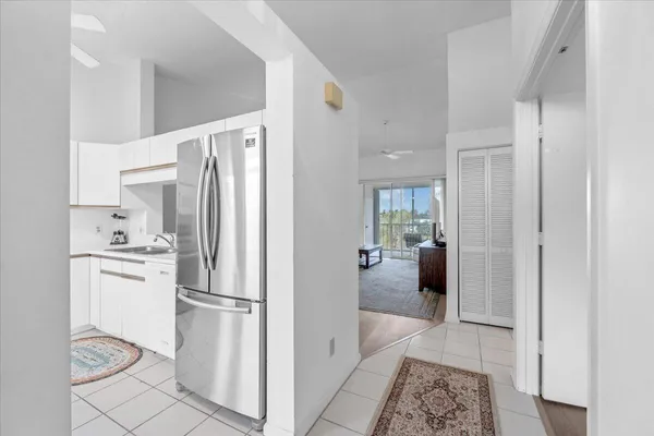 a kitchen with stainless steel appliances a refrigerator and a stove