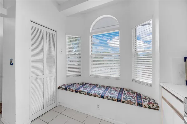 a spacious bathroom with windows and bathtub