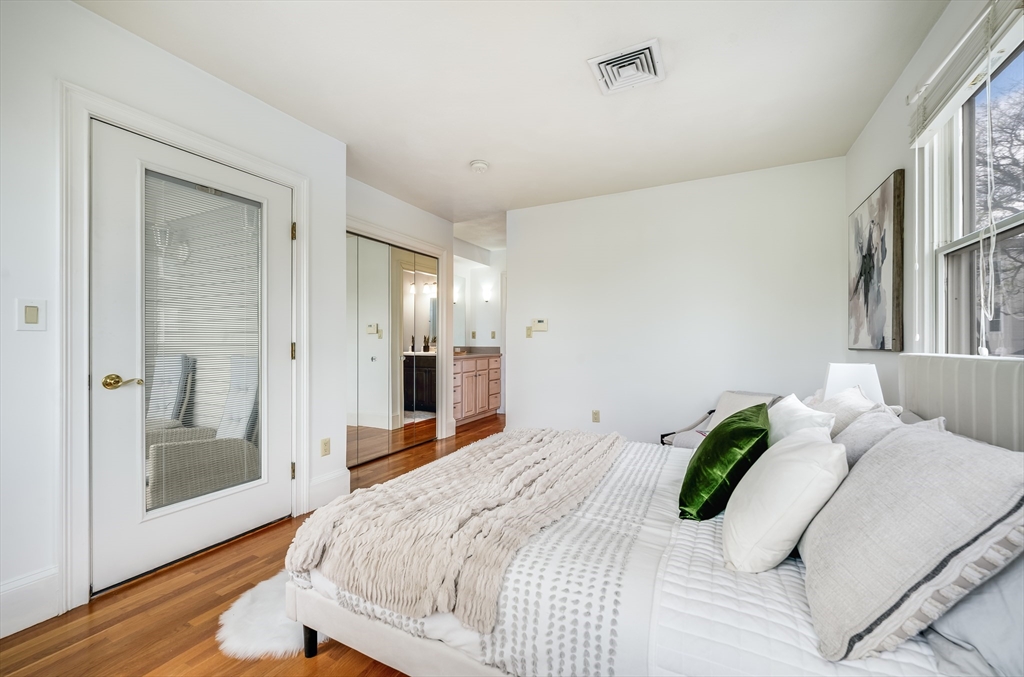 1520 Columbia Road, Unit 2 Boston, MA 02127 - Photo 13 of 16 a bedroom with a bed and wooden floor