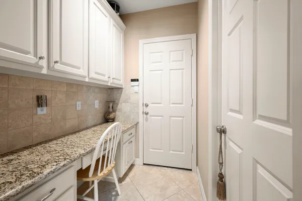 a view of a kitchen from the hallway