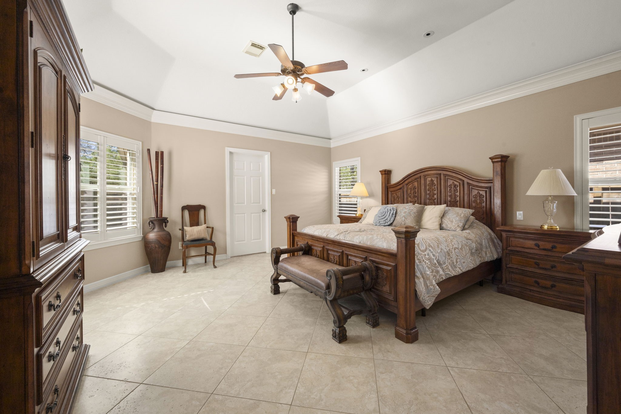 25051 Bow Wood Court Spring, TX 77389 - Photo 13 of 22 a bedroom with a bed and a chandelier