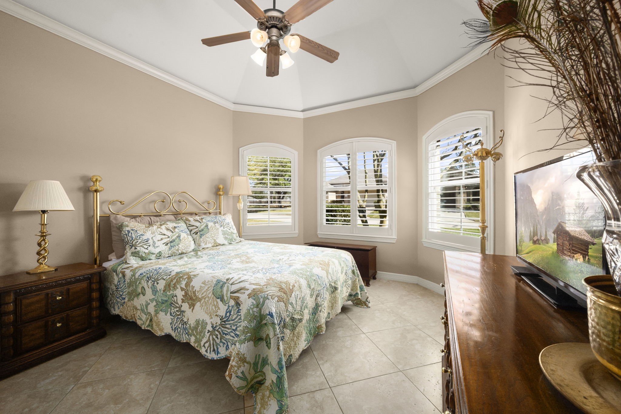 25051 Bow Wood Court Spring, TX 77389 - Photo 17 of 22 a bedroom with a bed and a chandelier