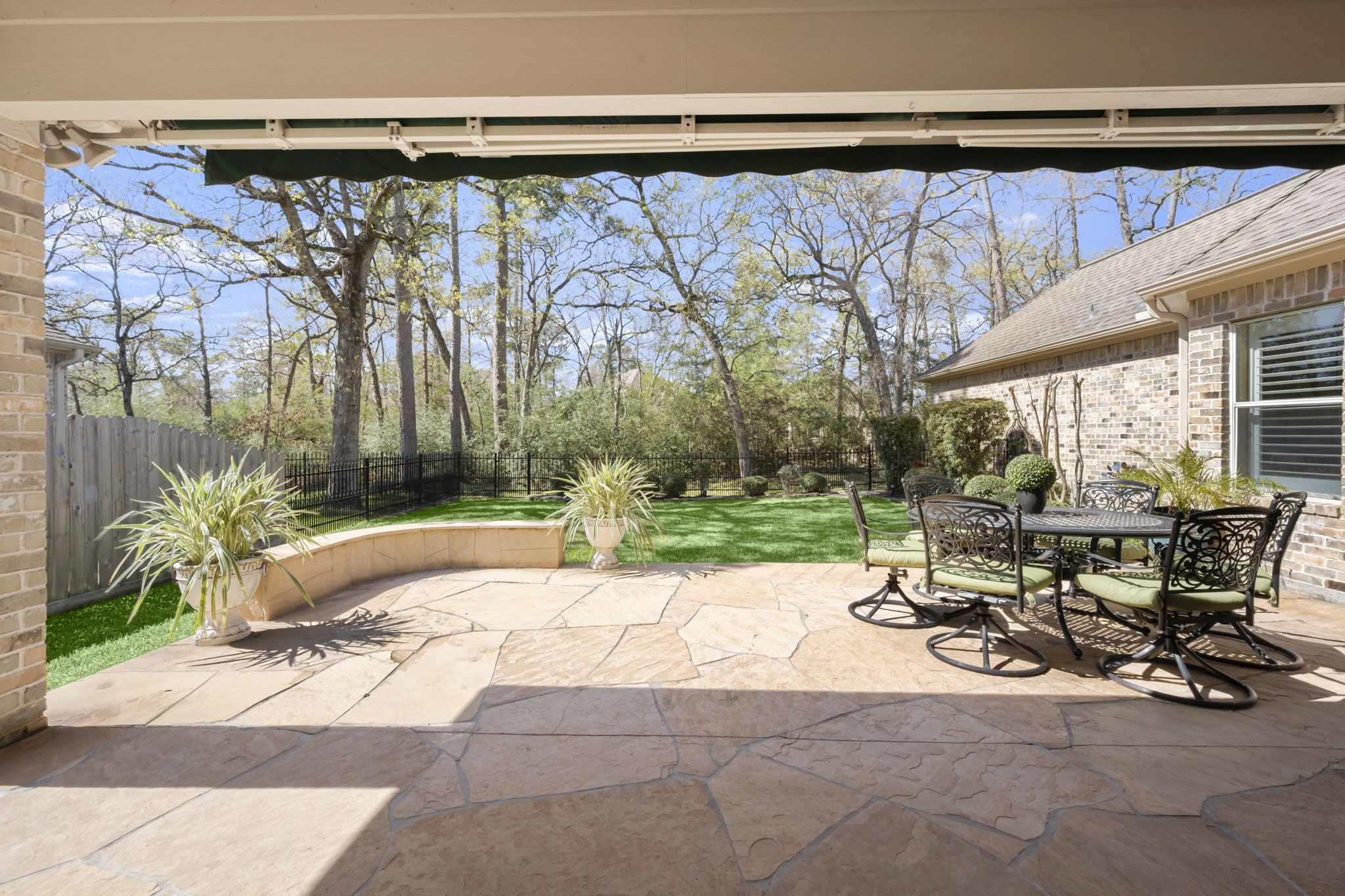 25051 Bow Wood Court Spring, TX 77389 - Photo 21 of 22 a view of backyard with table and chairs and potted plants