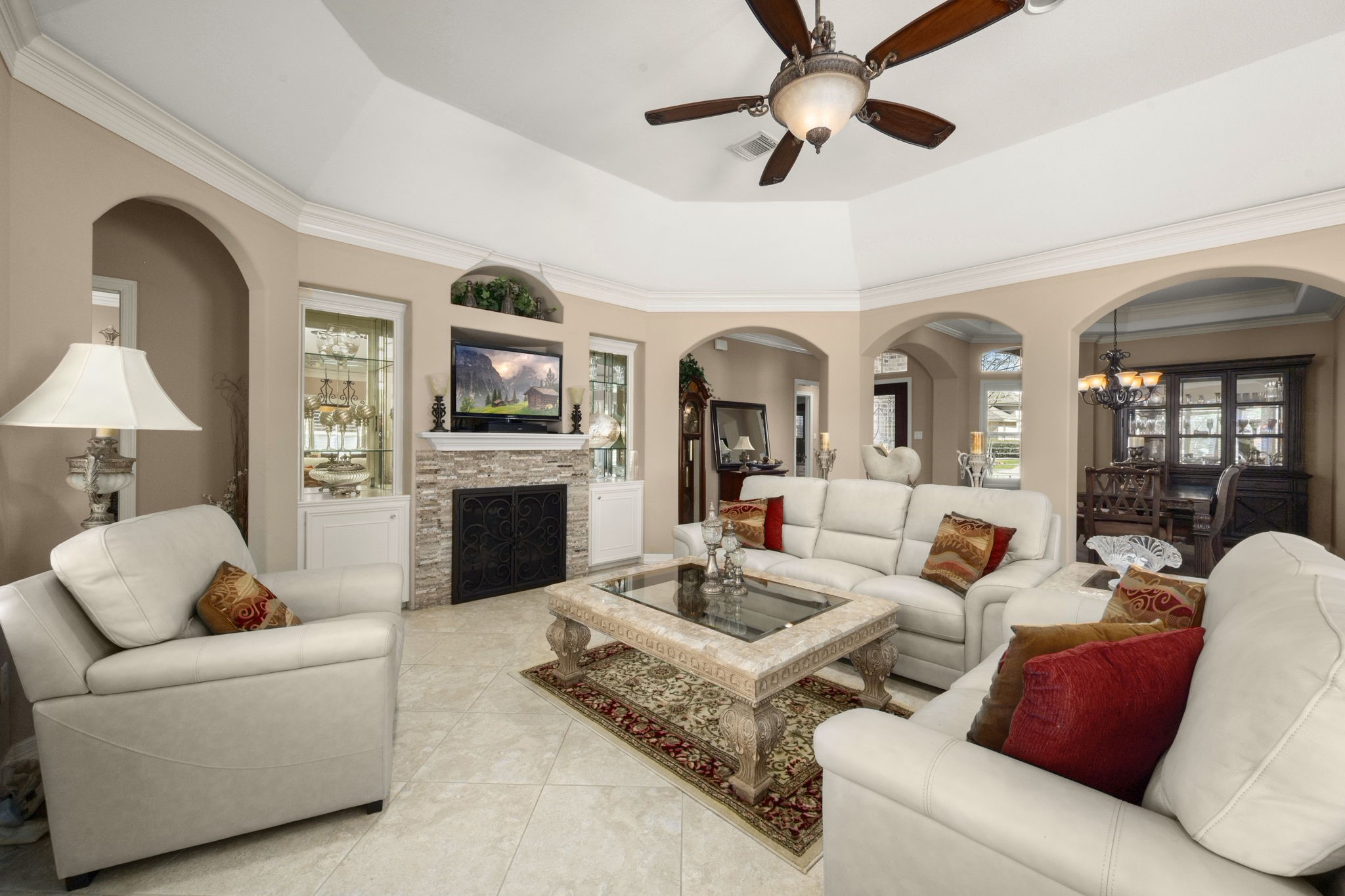 25051 Bow Wood Court Spring, TX 77389 - Photo 5 of 22 a living room with furniture fireplace and a chandelier
