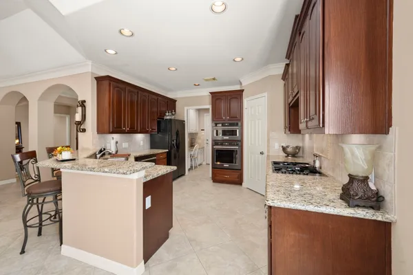 a kitchen with a sink a stove and refrigerator