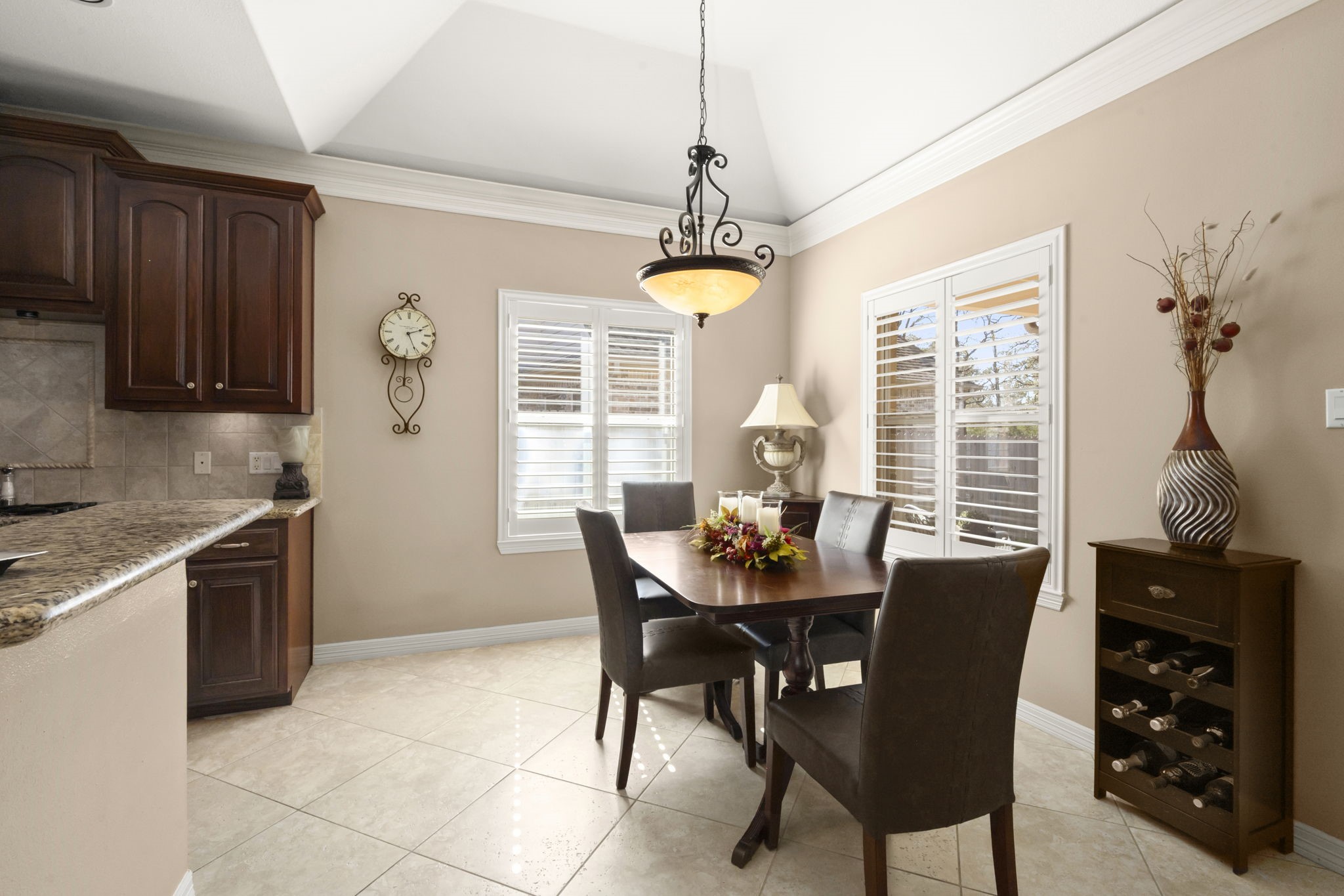 25051 Bow Wood Court Spring, TX 77389 - Photo 10 of 22 a dining room with furniture a chandelier and window