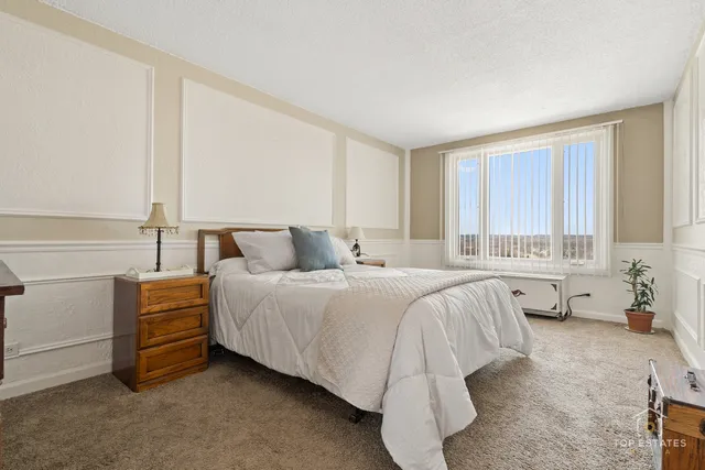 a bedroom with a bed and a couch