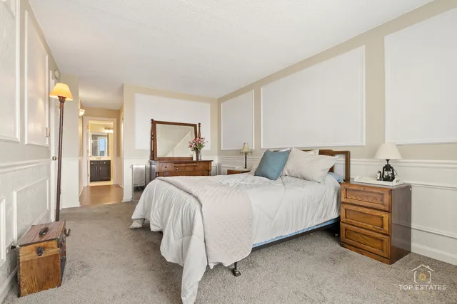 a bed room with a bed and a cabinets