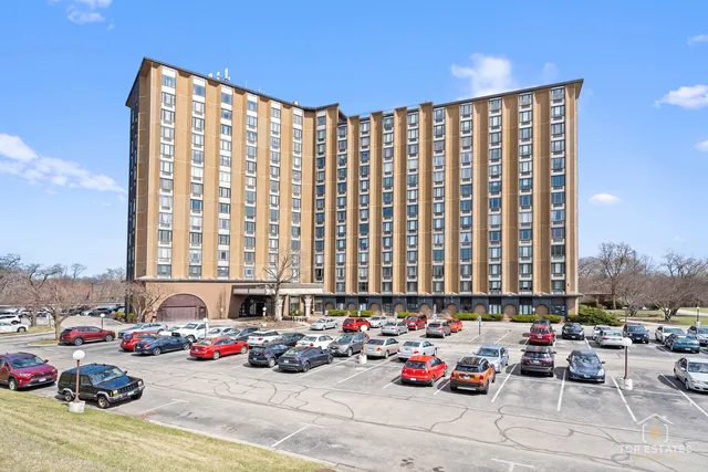 a cars parked in front of a blue umbrella