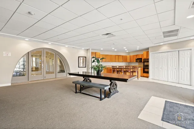 a view of a livingroom with furniture and a window
