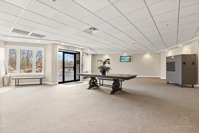 a room with furniture and pool table