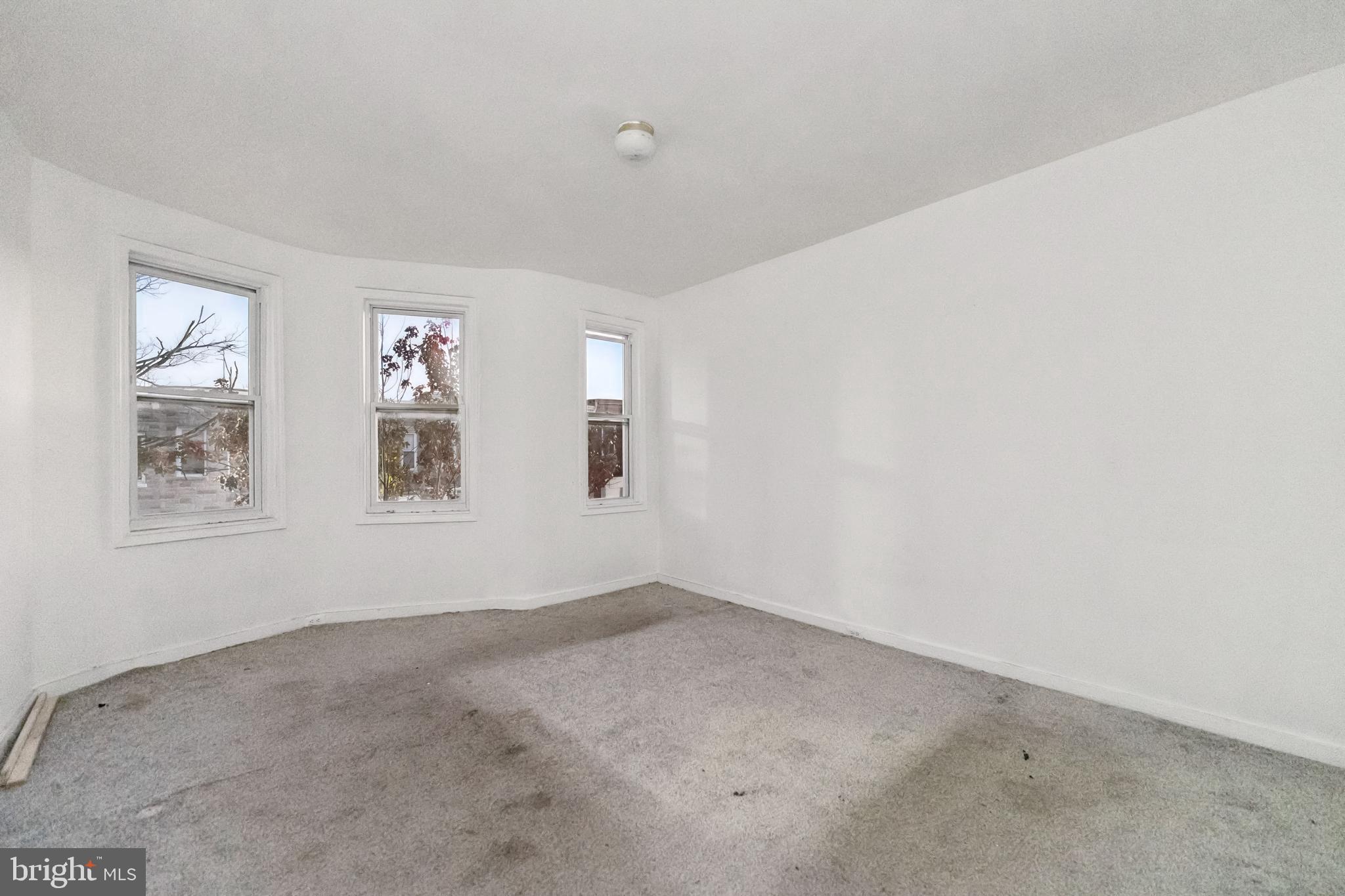 1828 Walbrook Avenue Baltimore, MD 21217 - Photo 12 of 15 an empty room with windows