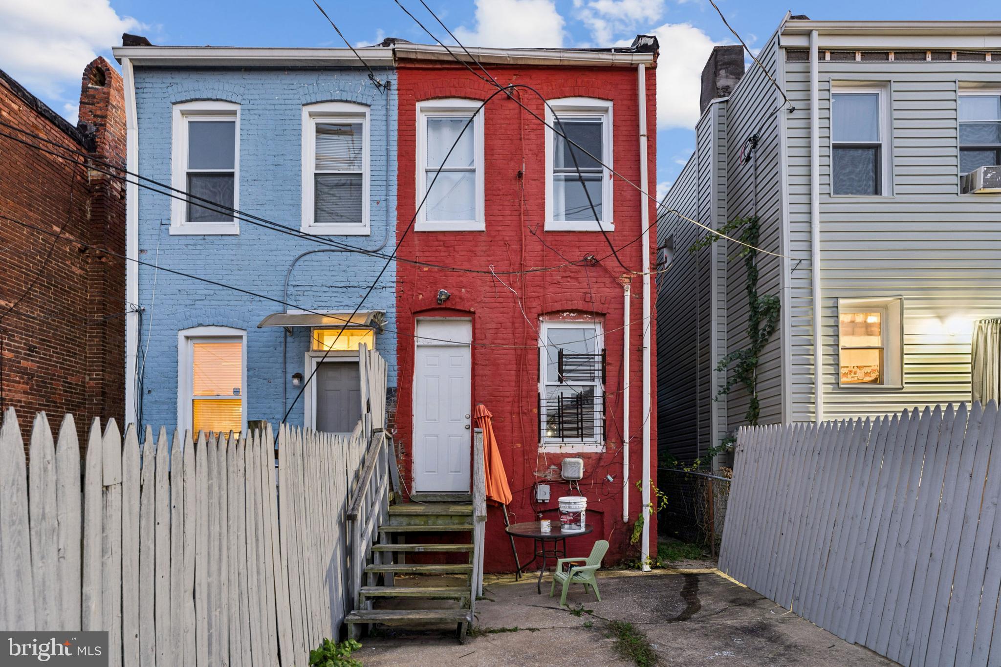 1828 Walbrook Avenue Baltimore, MD 21217 - Photo 15 of 15 a front view of a house with a fence