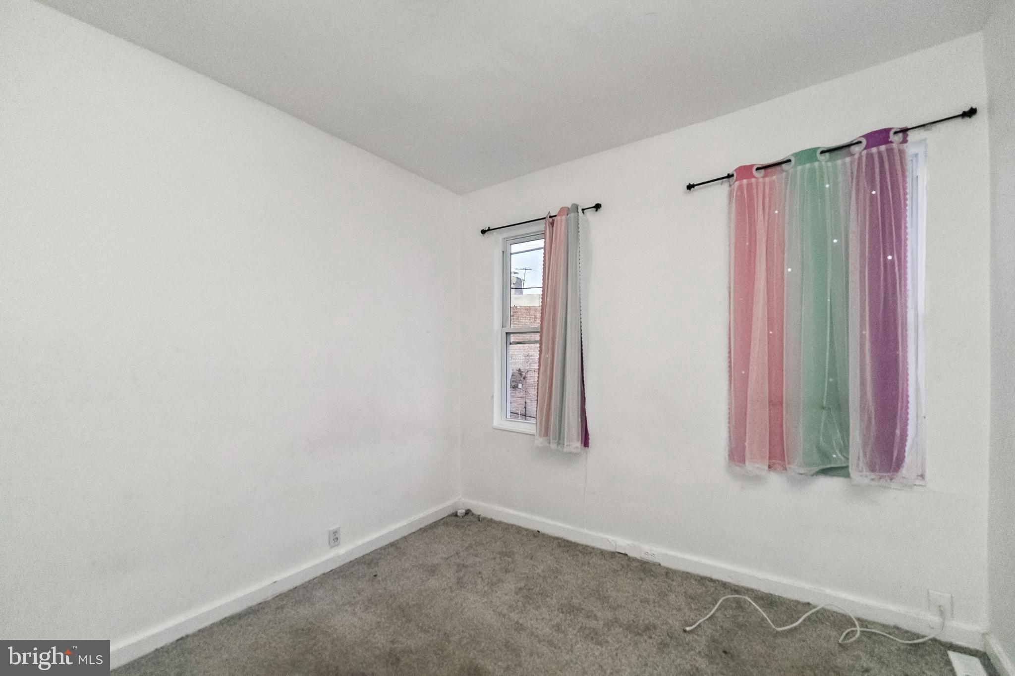 1828 Walbrook Avenue Baltimore, MD 21217 - Photo 9 of 15 a view of a room with window and gate