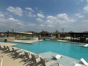 a view of house with yard and seating area