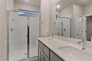 a white toilet sitting next to a shower