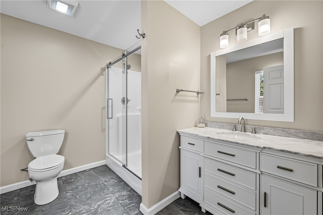 6264 Herbert Road Canfield, OH 44406 - Photo 20 of 47 Full bathroom with vanity and a shower stall