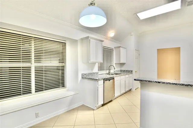 a kitchen with stainless steel appliances granite countertop a stove and a sink
