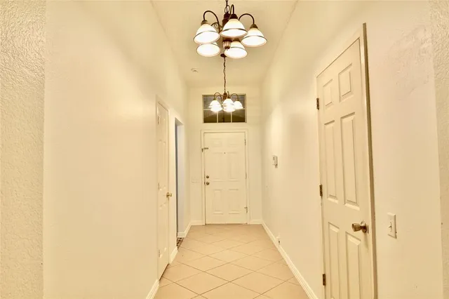 a bathroom with a chandelier