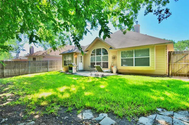 a house view with a garden space