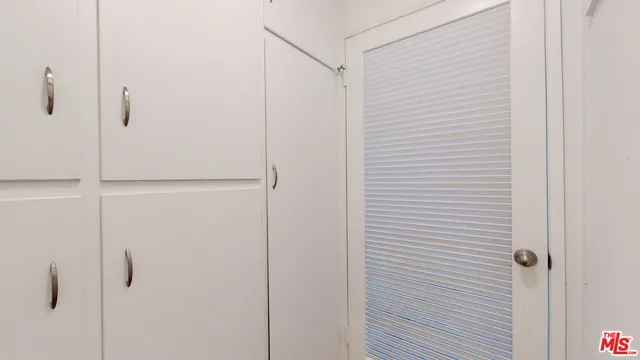 a view of an empty walk in closet