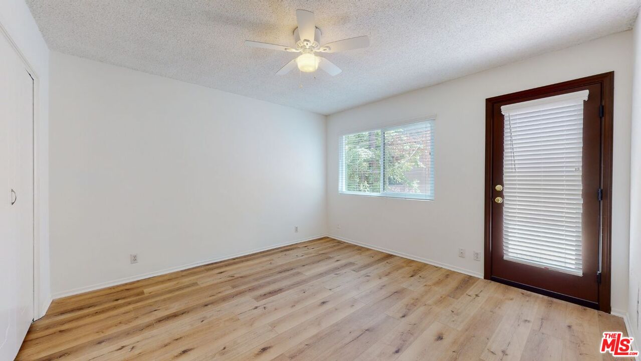 1827 Manning Avenue, Unit 6 Los Angeles, CA 90025 - Photo 20 of 22 wooden floor in an empty room with a window