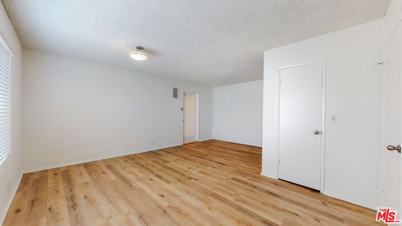 1827 Manning Avenue, Unit 6 Los Angeles, CA 90025 - Photo 7 of 22 a view of empty room with wooden floor