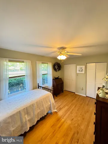 a spacious bedroom with a bed and a couch