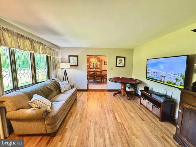 a room with furniture and a flat screen tv