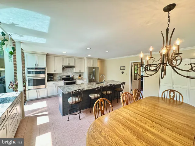 a room with furniture and view of living room