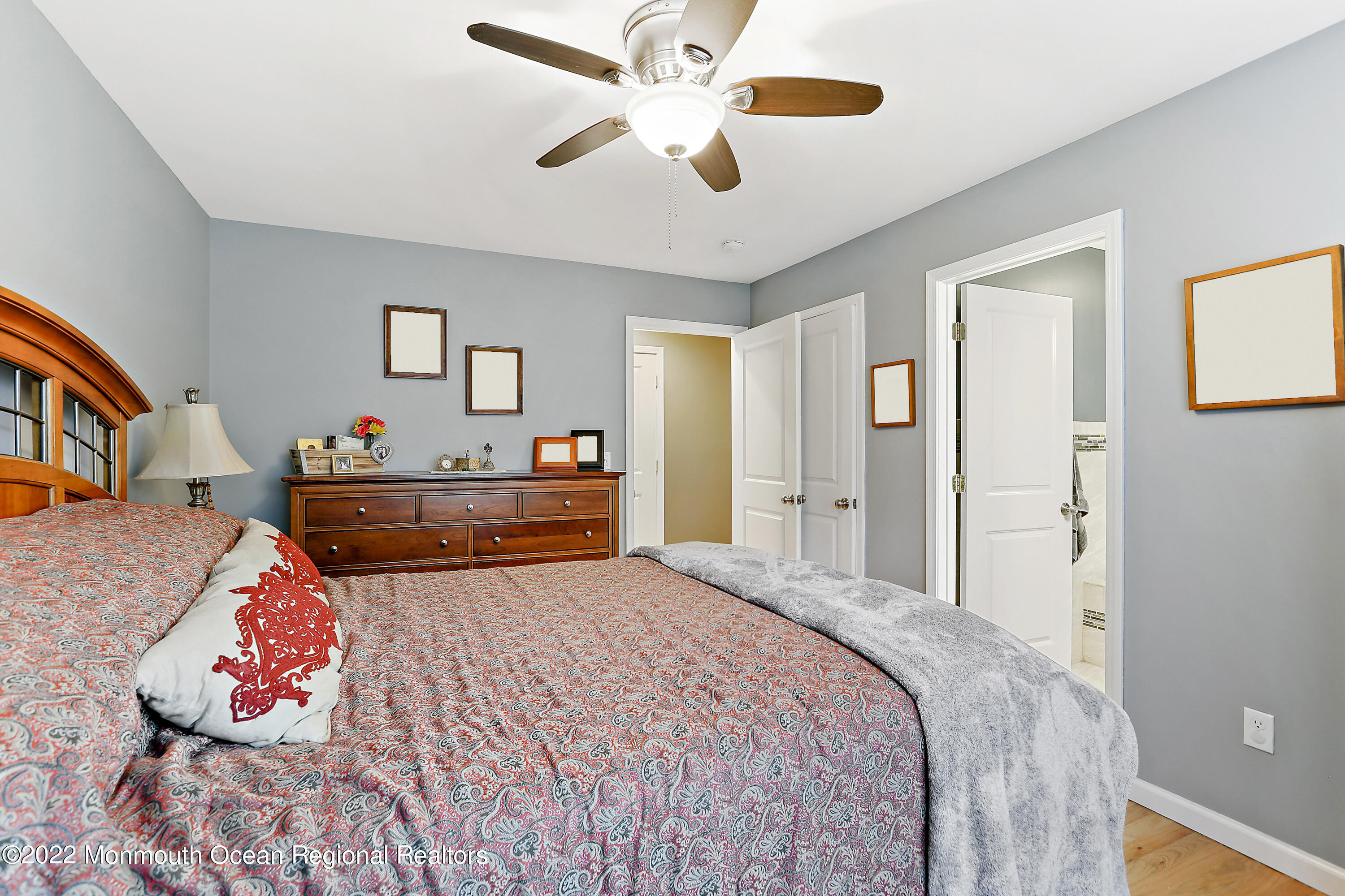 1849 Carmerville Road Wall, NJ 07719 - Photo 17 of 45 a bedroom with bed and a chandelier