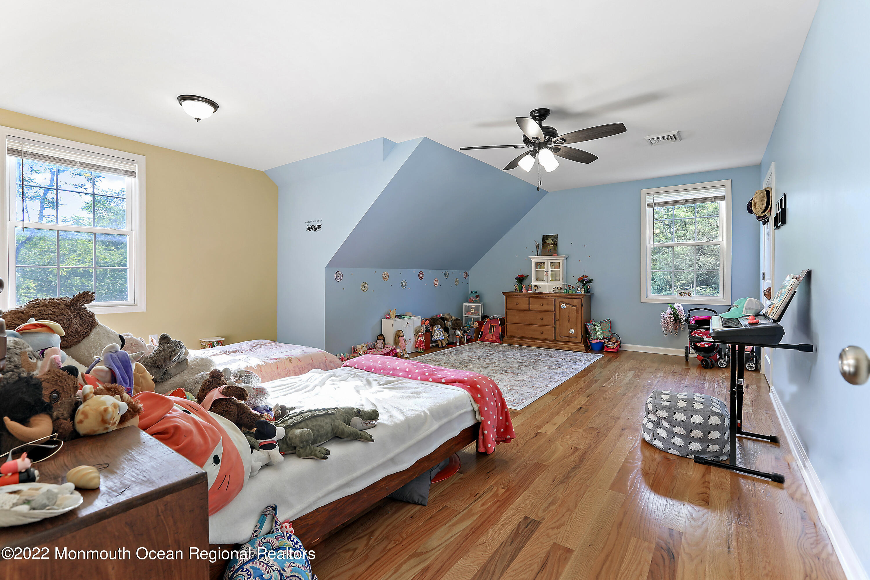 1849 Carmerville Road Wall, NJ 07719 - Photo 23 of 45 a bedroom with bed and a chandelier