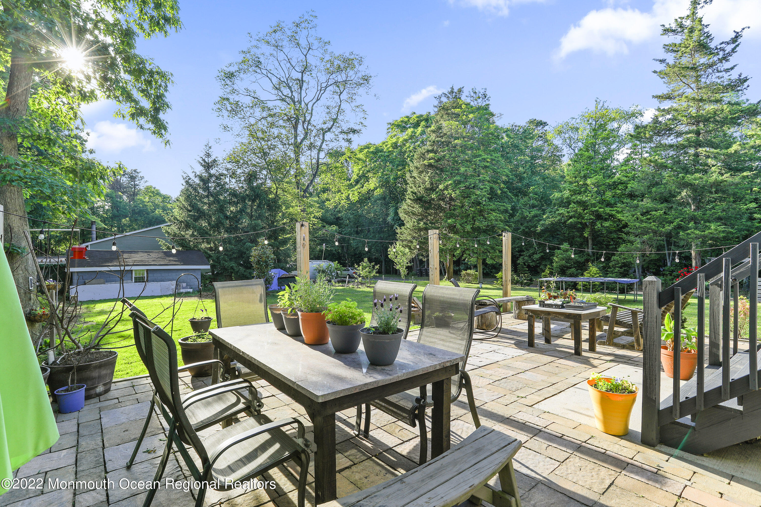 1849 Carmerville Road Wall, NJ 07719 - Photo 39 of 45 an outdoor space with furniture and umbrella