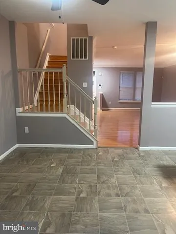 a view of entryway and hall with a front door