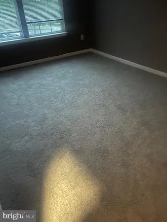 a view of empty room with a window