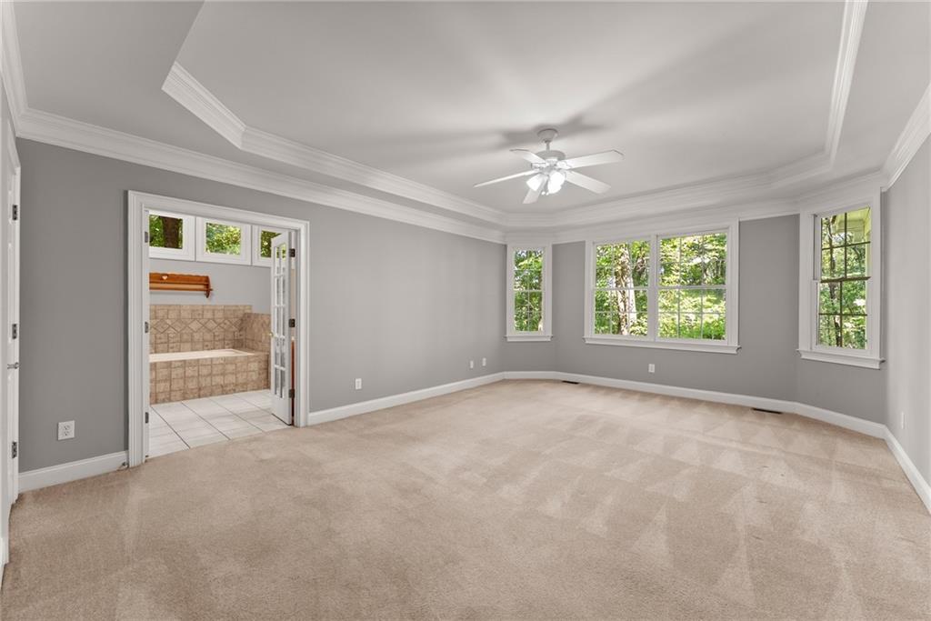 1040 Auburn Road Dacula, GA 30019 - Photo 24 of 65 an empty room with windows and closet