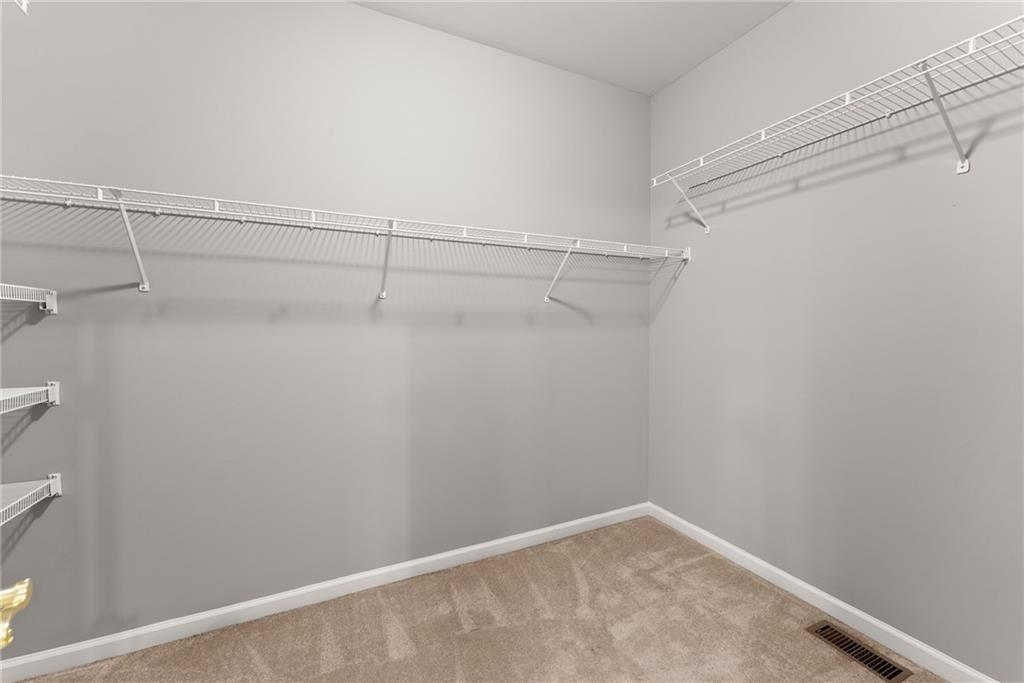 1040 Auburn Road Dacula, GA 30019 - Photo 29 of 65 a view of small space with racks on the wall