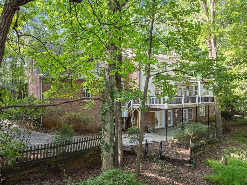1040 Auburn Road Dacula, GA 30019 - Photo 4 of 65 a view of a chair and table in the patio