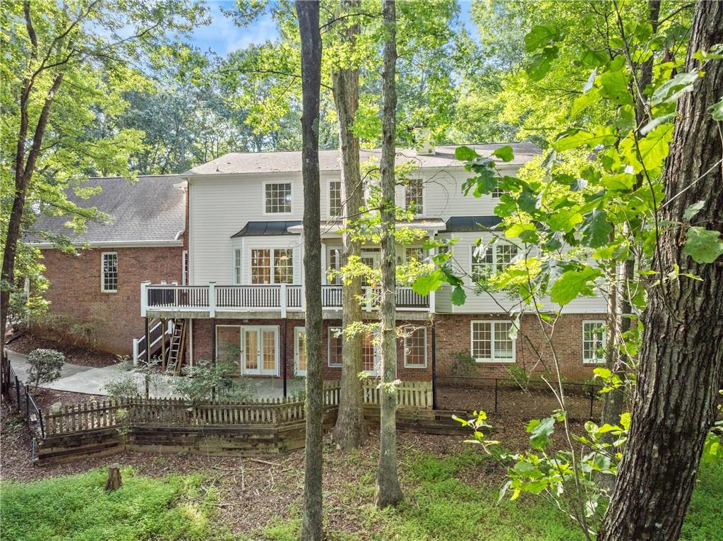 1040 Auburn Road Dacula, GA 30019 - Photo 58 of 65 a backyard of a house with lots of green space