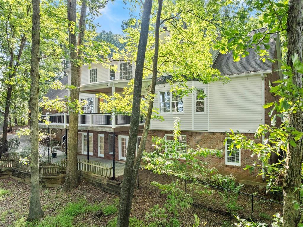 1040 Auburn Road Dacula, GA 30019 - Photo 59 of 65 a view of a chair and table in backyard of the house